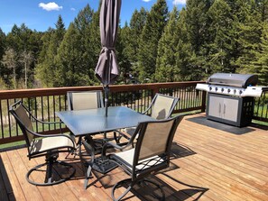 Deck and Grill with additional  outdoor chairs in storage
