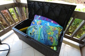 Chest on the lanai filled with beach equipment