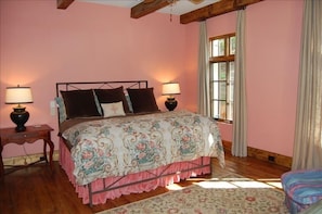 Master bedroom on main level with flat screen TV