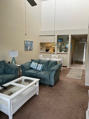 View from living room toward the kitchen and front door. 