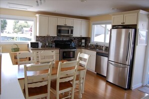 Prepare your meals with the conveniences of home with ocean and Mt. views