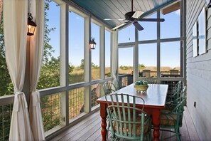 Outdoor Dining Room next to gas grill, facing beach