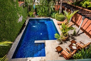 The largest pool in Villas Cerca del Mar development features a spacious deck