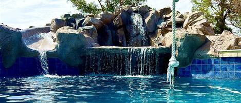 MASSIVE amazing pool with rope swing, rock water feature and slide 