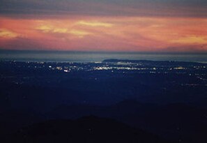 Point Loma and downtown San Diego at sunset.