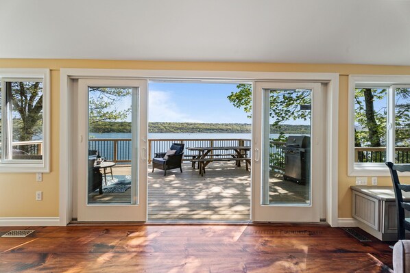 Sliding glass doors from the living room to stunning Cayuga Lake views.
