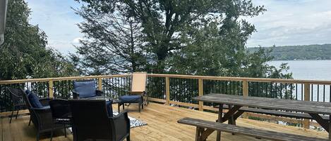 New upper deck with seating area, picnic table and BBQ.