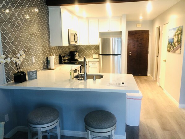 Newly remodeled kitchen with all new appliances, cabinets, countertop and floor