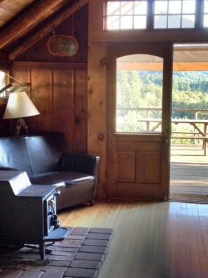 The little cabin 
main room with wood stove.