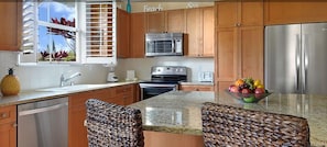 Granite counter tops in the gourmet kitchen with Stainless appliances.