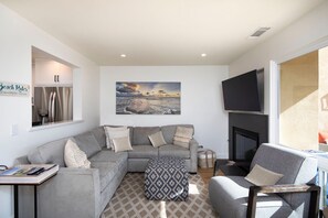 Family room with lots of comfortable seating off the kitchen and dining area