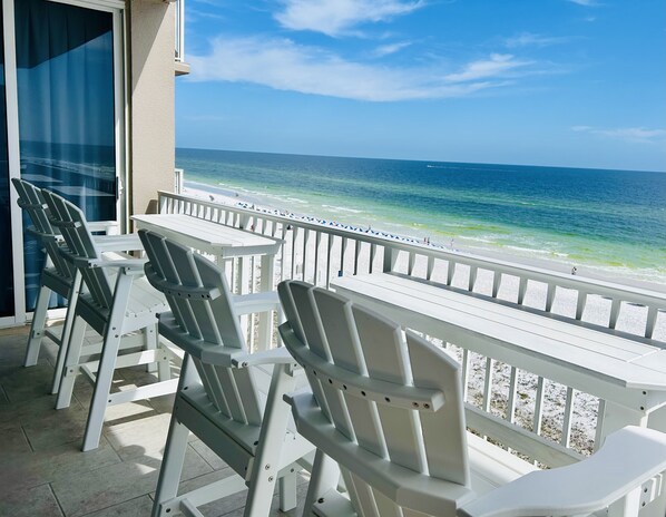 Gorgeous balcony view of the crystal clear emerald water and sugar white sand.