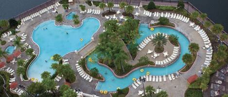 Aerial view of one of the pools, lazy river and lake