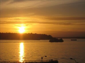 Sunset; ferry boat views await you from the living/dining room and bedroom!