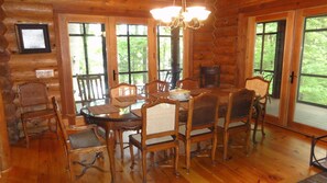 Dining room with attached screen porch. All with lake view