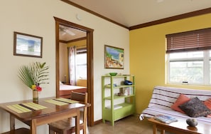 Living / dining space with bedroom door open
