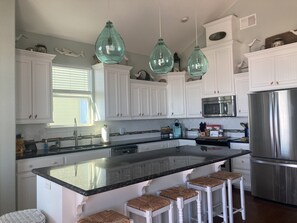 Fully stocked gourmet kitchen with convection oven and warming drawer.  