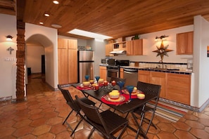 Full kitchen with range, microwave, refrigerator and dishwasher.