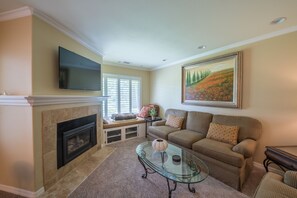 Large TV and fireplace in the living room