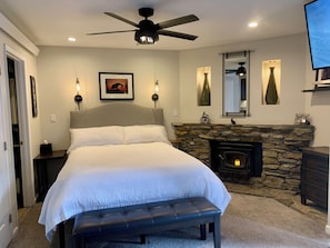 Cozy bed with new mattress, ceiling fan and quiet and warm radiant wall heaters