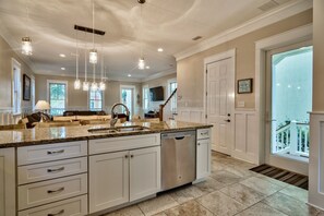 View from the back of the Kitchen overlooking the Dining room & Family room