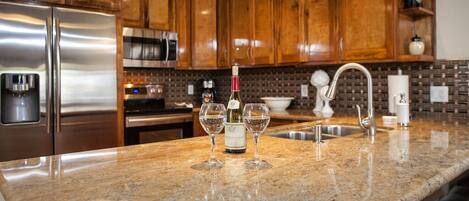 Kitchen with new granite, cabinets and SS appliances