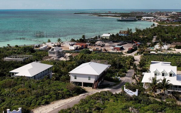 Pirate's Place w/ the brown stairs. View from the Settlement toward Baker's Bay