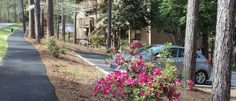 Paved walking path is steps from the door and leads to The Club and beyond. 