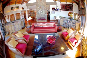 Expansive living room with fireplace and 270 degree 
