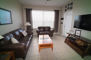 Living room area with 55” Smart TV