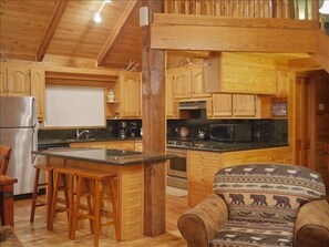 View of kitchen. Granite counters. 2 ovens. All you need to cook a gourmet meal.