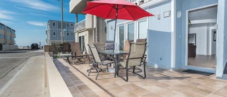 Ocean view from the coveted 34th Street front patio, two houses back from beachfront and boardwalk; includes outdoor dining, propane bbq grill, market umbrella.