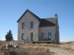 True Prairie Home, nestled in the Flint Hills, surrounded by a sea of grass.