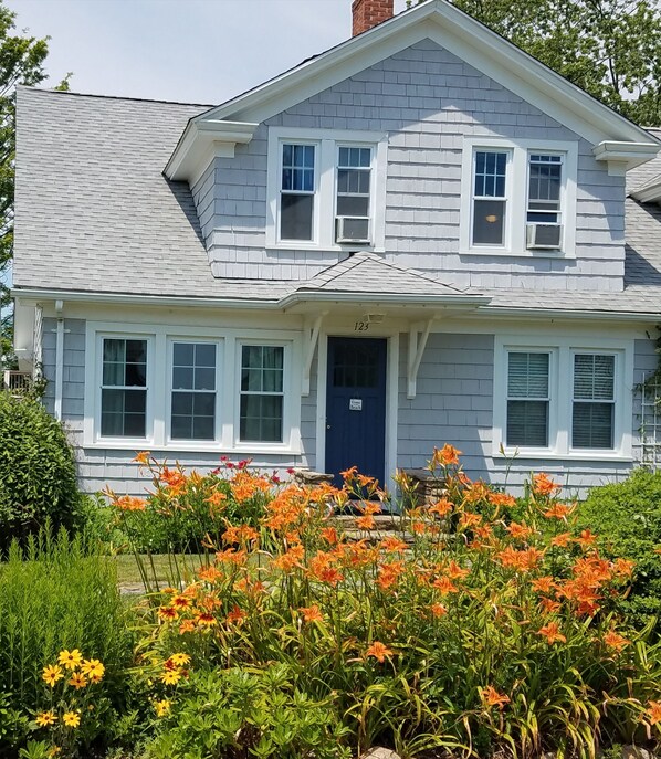 You will be met with blooming flowers and a view of the Long Island Sound.