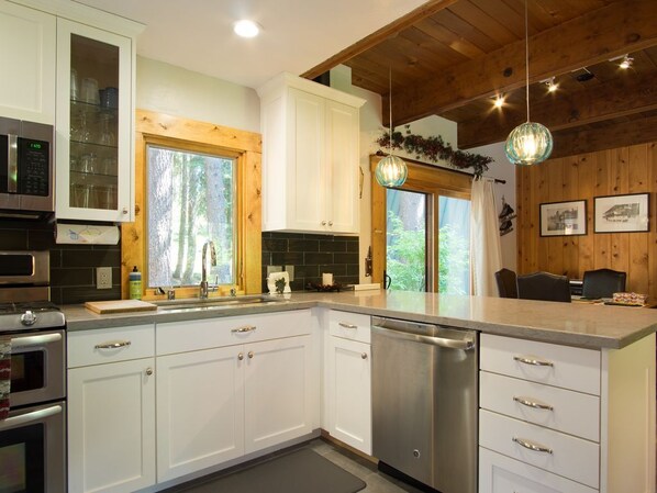 Enjoy cooking in this modern, remodeled kitchen, complete with high-end stainless steel appliances that make meal preparation a breeze
