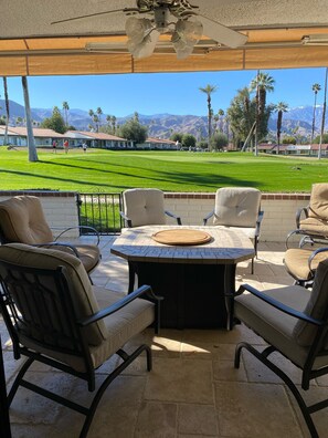 Comfortable patio seating with adjustable awning for shade