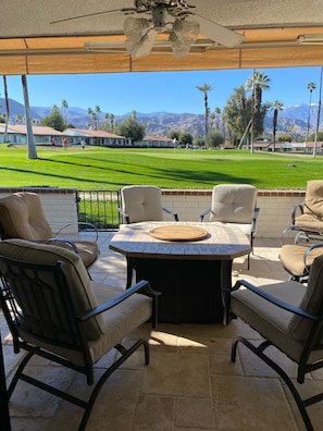 Comfortable patio seating with adjustable awning for shade