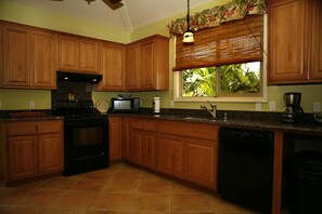 Kitchen with granite counters.