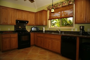 Kitchen with granite counters.