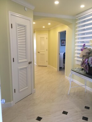 New large foyer leading into the condo. Entry is right across from elevator!