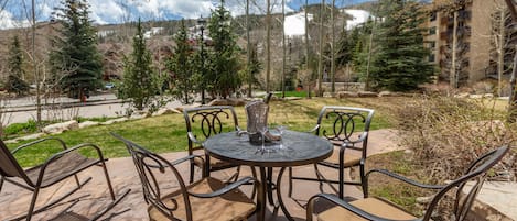 Patio table with four chairs and Gas Grill
overlooking Vail Mountain