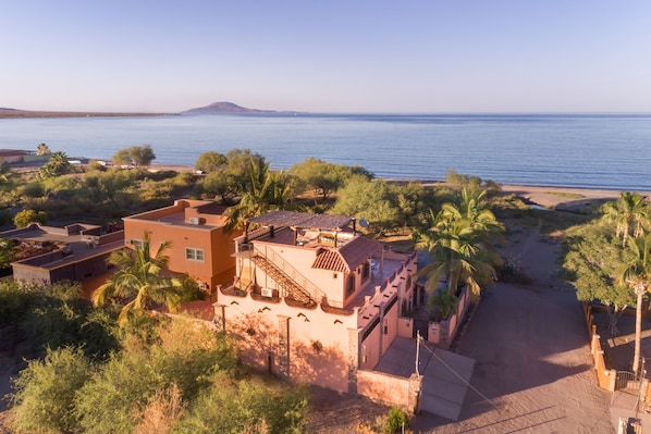 Villa is on the right. Path to the beach is visible 