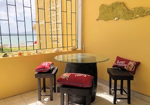 Outdoor dining for (4) at our Cruzan Rum barrel table
