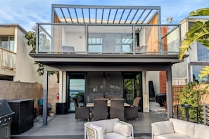 Our magical back deck includes a fire table, pyramid patio heater, and gas grill