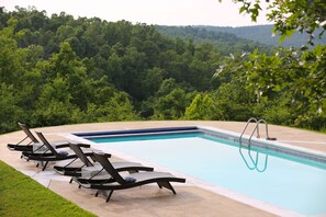 Heated pool with stunning lake and mountain views.