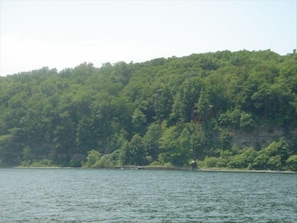 A view of the beach front and cottage from the water