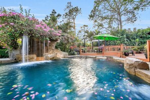 Lagoon Resort Spa/Pool/Slide. In Pool table-sitting area. View sitting deck area