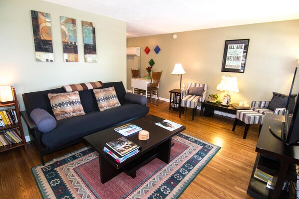 Living room with comfy full-sized futon and reading nook