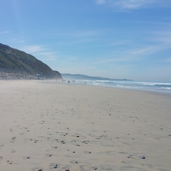 1 mile south in Torrey Pines State Reserve. free+ paid parking, restrooms