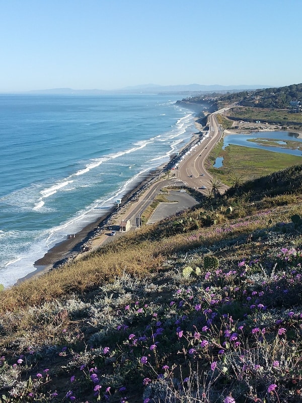 House is 2miles North on the right horizon. Cars may park free by beach below
